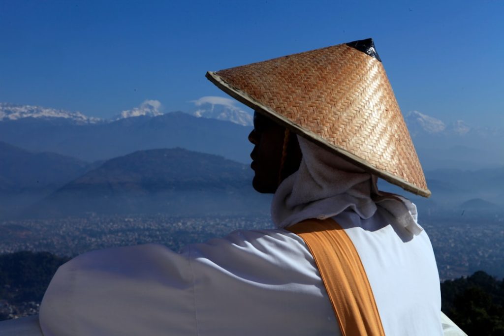 a person wearing a conical hat