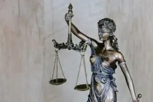 a statue of a woman holding scales