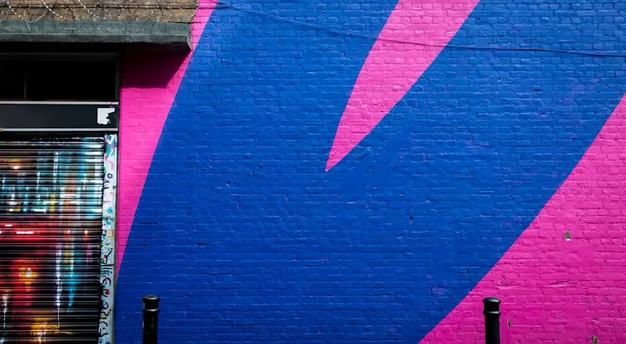 a blue and pink painted brick wall