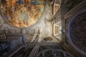 a ceiling with art on the walls