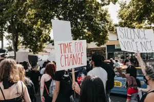 a group of people holding signs