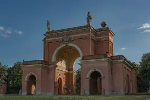 a large stone archway with statues on top